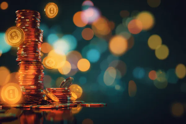 Um homem concentrado em seu laptop com estatísticas ao vivo ao fundo, destacando os recursos dedicados de esportes e jogos do app móvel 7KBT.